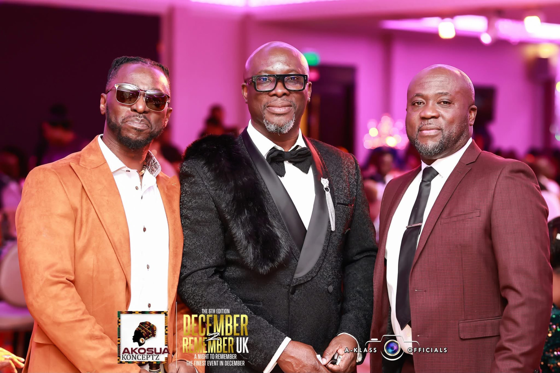 Three guests in orange, black and burgundy suits at December To Remember UK