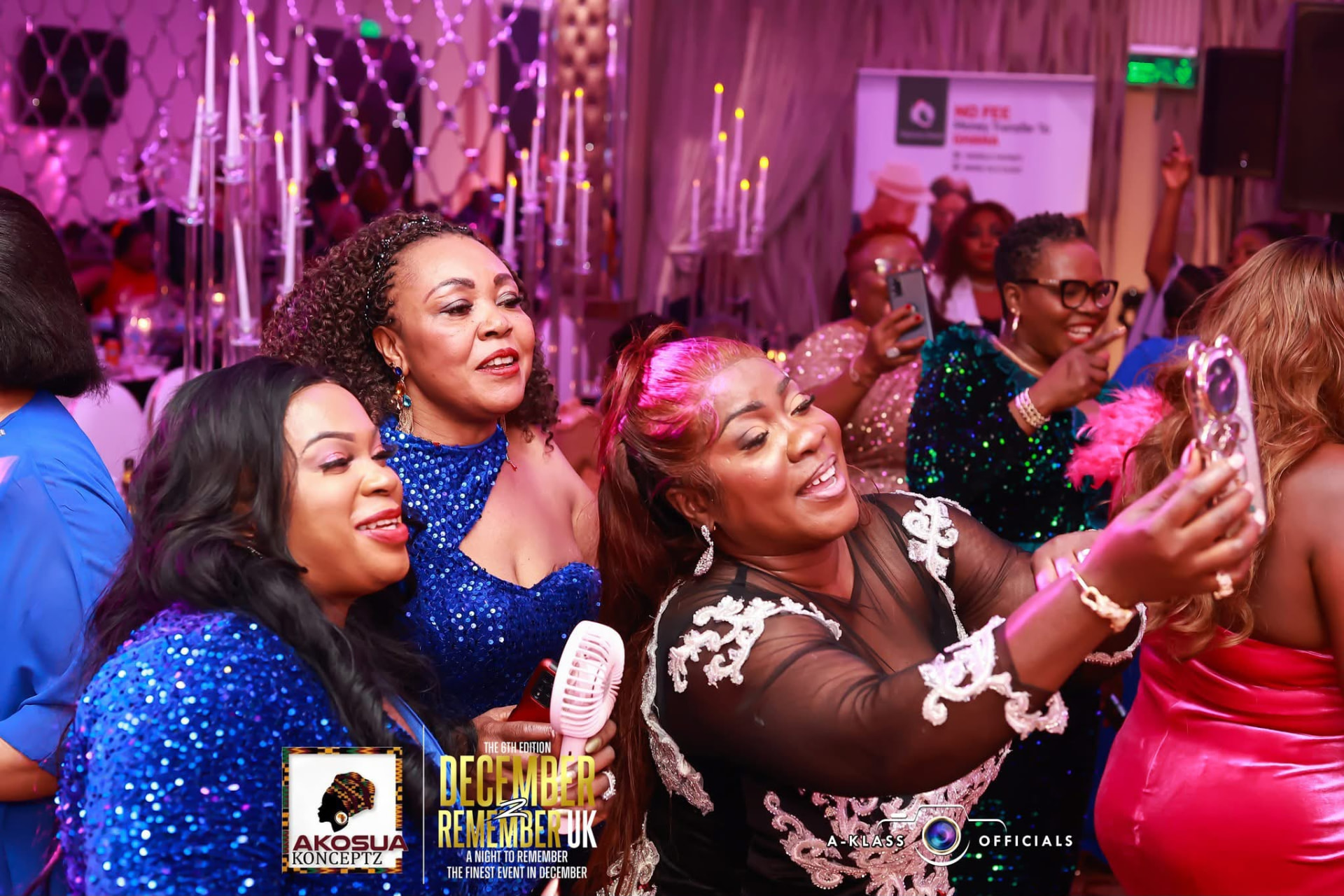 Guests in jewel-toned sequins capturing the night on a phone
